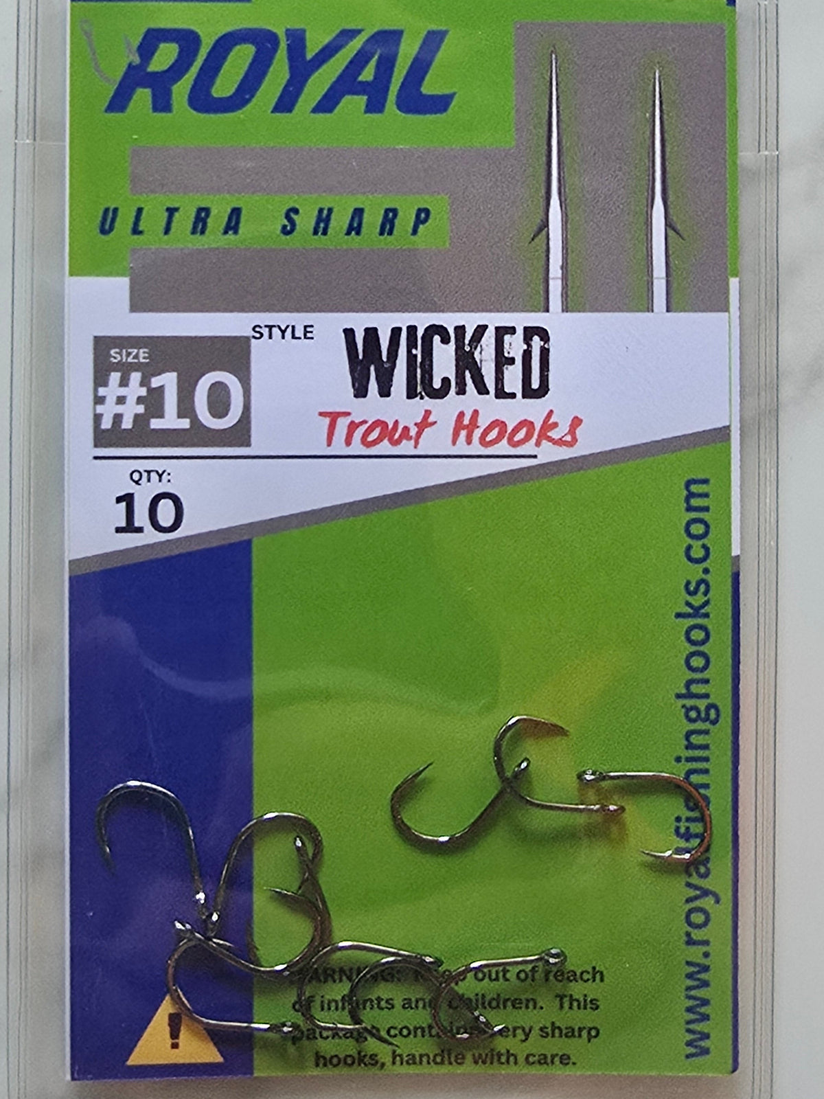 A package of 10 Royal Wicked Style #10 Ultra Sharp Trout Hooks in clear plastic blister packaging, displayed on a white marble surface.